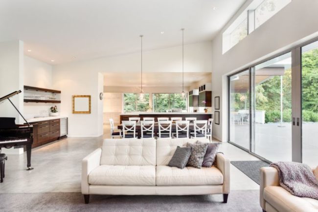 45169189 - beautiful living room in new luxury home with view of dining room table and kitchen