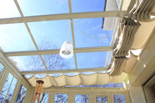 47184821 - blue sky visible from the sunroof of the conservatory