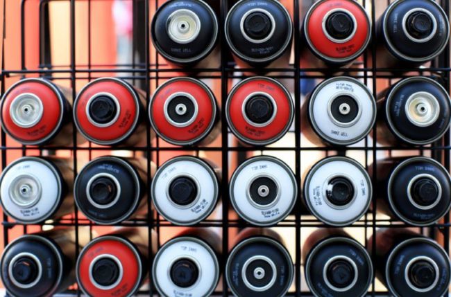 44100095 - spray cans of paint for graffiti on the wall