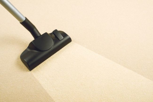 30872324 - vacuum cleaner sweeping brand new carpet  housework and home hygiene