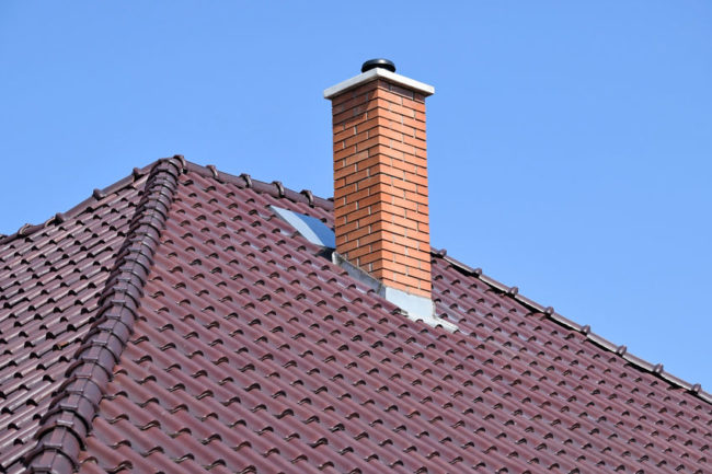 47748364 - house roof with smoke stack